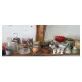 Shelf full of glass and pottery items