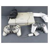 Sony PlayStation Console, 2 Controllers, and 4