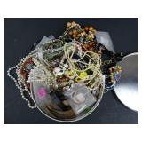 Lot of Assorted Costume Jewelry in Tin