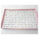 Lot of 100 New Costume Jewelry Rings in Holder -