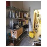 Stainless steel shelf.  About 7ft tall Stuff on