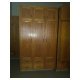 Solid oak 3 door cabinet. First come first pick.
