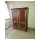 Wood armoire measures about 62in x 43in