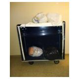 Rolling laundry cart on wheels.  Has 3