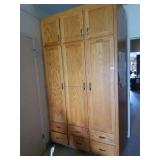 Solid oak cabinet. Measures about 53in wide and
