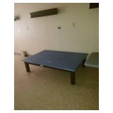 Large cushioned table. Solid in good condition .