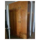 Solid oak cabinet. Measures about 52 in wide and