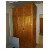 Large solid oak cabinet. Measures about 53in wide