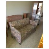 Floral loveseat. Approx size 57 on wide and 25in