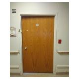 Steele door frame with wood door and hardware.