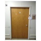 Steele door frame with wood door and hardware.