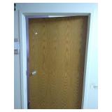 Steele door frame with wood door and hardware.