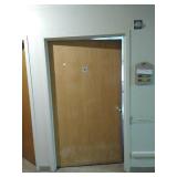 Steele door frame with wood door and hardware.