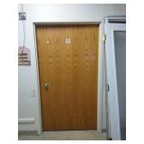 Steele door frame with wood door and hardware.