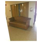 Nice tan leather couch with tuffed back and