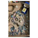 Flat of assorted jewelry. Purdue money clip