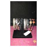 11 bracelets. Stand NOT included