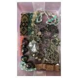 Container of assorted jewelry