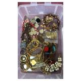 Container of assorted jewelry
