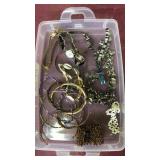 Container of assorted jewelry