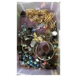 Container of assorted jewelry
