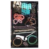 Flat of bracelets. Container not included.