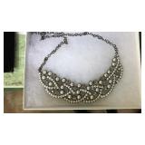 Fancy necklace in box.