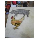 Smoked bacon metal sign and wood chicken sign.