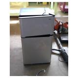 Haier mini fridge w/freezer.  Approximate size is