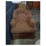 Brown upholstered swivel rocker
