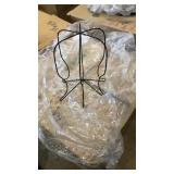 Box of metal hat holders. Looks to be at least 20