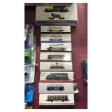 9 assorted train car plastic toys