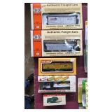 5 assorted toys. 2 Con-Cor HO freight cars,