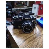 Konica Camera with a flash bulb, a Tamaron