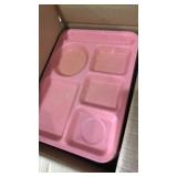 Stack of plates and box of trays