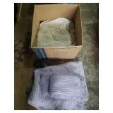 Group of purple and white chenille blankets.