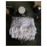 Pretty pink bed spread with sheets, green blanket