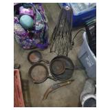 Group of cast iron skillets, fake gun , and bonus
