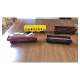 4 Lionel train cars. Red electric car has 1