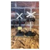 2 railroad metal crossing signals. Left is