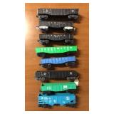 Flat of assorted Lionel train cars.