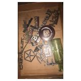 Flat of goodies, hood ornaments, belts and bottle