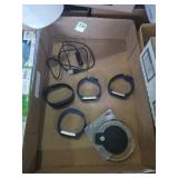 Group of 4 fitbits and 1 charger and wireless
