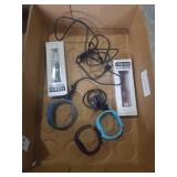 3 fitbits and charger and 2 bands