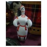 Red, white, and black cermanic lady. Measures