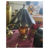Copper lamp with dark brown slag glass shade.