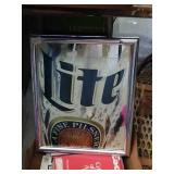 Lite advertising mirror. 
Approx. size 19x15.