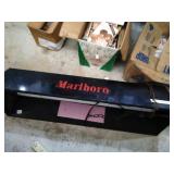 Hanging Marlboro light.
Approx. size 41x13 1/2.