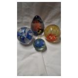 Group of 4 very pretty paper weights. By Kays