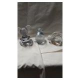 Three bubbled glass paperweights.